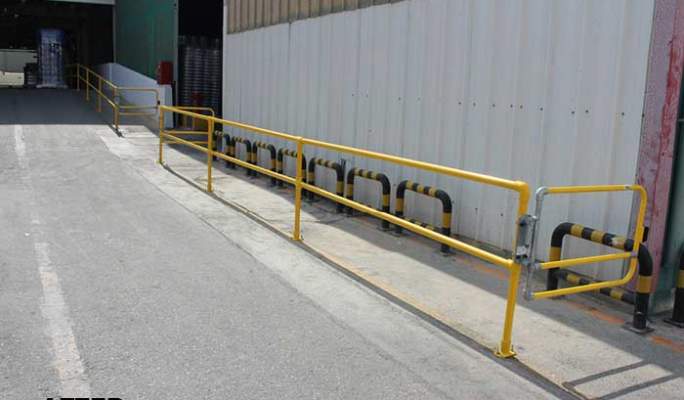 Pedestrian routes near loading and unloading areas after, with safety guardrails and self-closing gates segregating vehicles and pedestrians