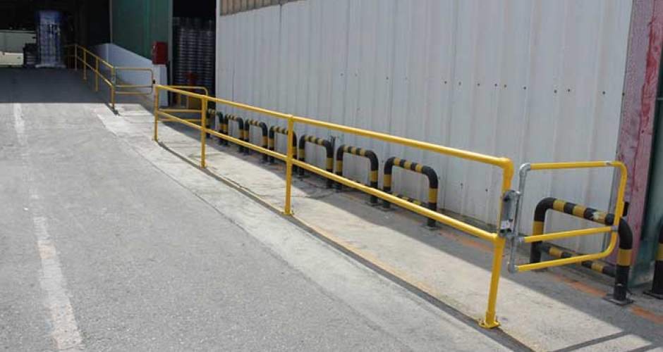 Pedestrian routes near loading and unloading areas after, with safety guardrails and self-closing gates segregating vehicles and pedestrians