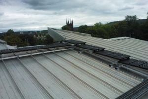 Roof top walkway to a standing seam roof